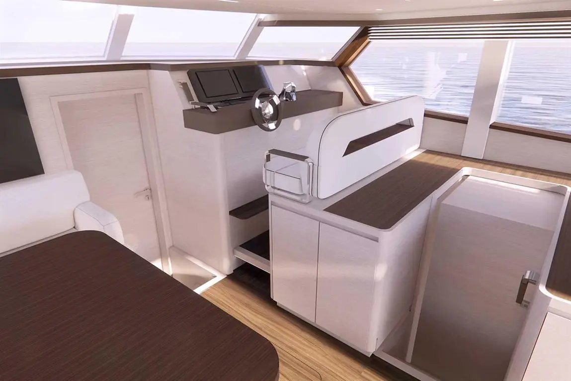 Modern yacht interior featuring a control panel, steering wheel, and storage cabinets illuminated by natural light from windows.
